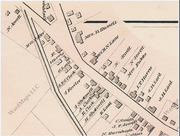 The 1884 map shows a barn or shed (indicated by an X) beside the Dow-Harris house in the same position as the photo of the children.