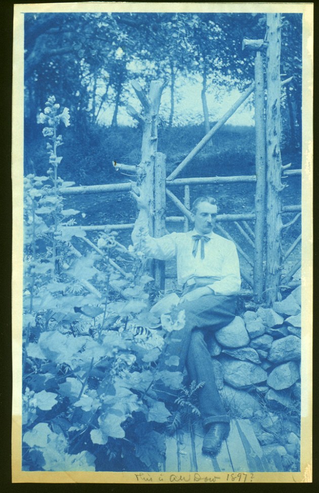 Dow posing on stone wall cyanotype by Arthur Wesley Dow