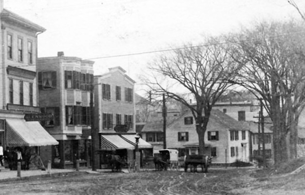 A closeup from the Damon Building photo shows the two small houses above.