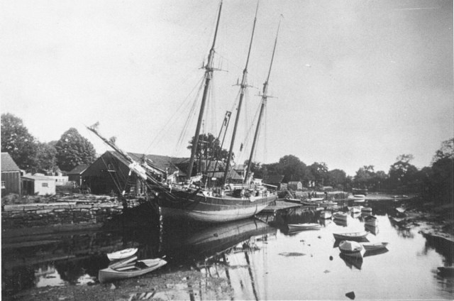 A coal ship unloading at Glover's Wharf