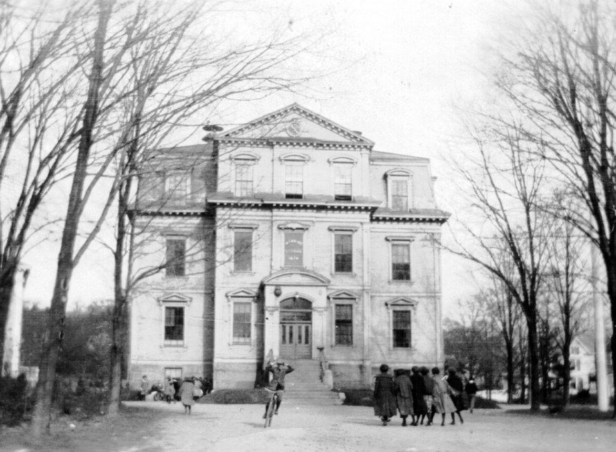 A student at Manning High School in Ipswich, riding with no hands