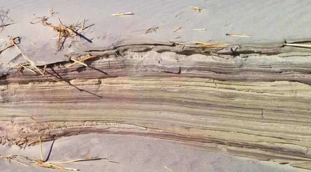 Erosion shows lavers of sand of different colors in the sand along the Castle Neck River on the back side of Castle Neck.