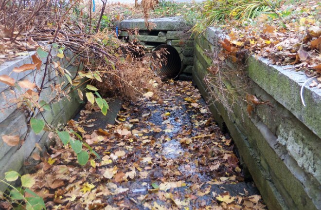 Farley Brook goes underground behind the laundromat on Central Street