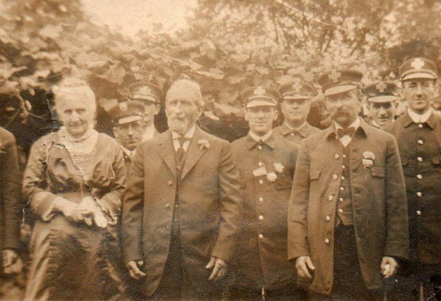 John Leander Gaudette and his wife Ida, who are believed to have lived in this house in the 1800's, standing with Ipswich firemen.