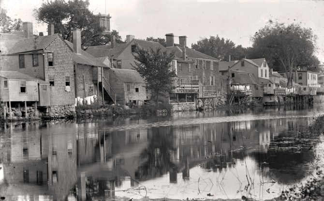 A view of the rear of the buildings on South Main Street, just below the dam was known as "Little Venice." Photo by George Dexter, circa 1890.