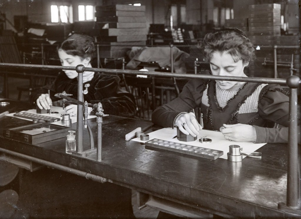 Women doing hand work in a factory, early photos from Ipswich Massachusetts
