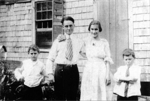 Harold Bowen (left), his parents and twin brother, in front of this house