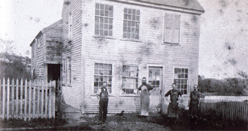 The Perkins and Daniels Shoe Shop started in this small house on Summer Street, shown above, which no longer stands.